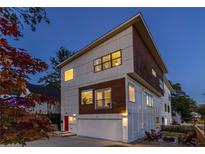 Modern two-story home with a red door and attached garage at 165 Mayson Ne Ave # A, Atlanta, GA 30307