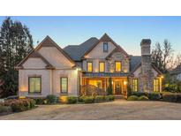 Stunning two-story house with stone accents and landscaped lawn at 4455 Leesburg Rd, Marietta, GA 30066