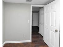 Bright bedroom with hardwood floors and neutral walls at 281 Valley Lake Dr, Stone Mountain, GA 30087