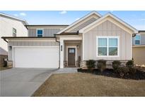 Two-story house with gray siding, white trim, and a brown front door at 79 Dew Drop Ln, Dallas, GA 30157