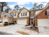 Charming townhomes with attached garages and well-maintained landscaping create inviting curb appeal at 5800 Oakdale Se Rd # 147, Mableton, GA 30126