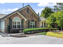 Inviting ranch home with stone accents and manicured landscaping at 104 Highlands Ridge Se Pl # 1, Smyrna, GA 30082