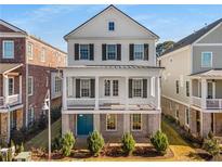 Two-story home with white siding, black shutters, and a front porch at 7535 Cordery Rd, Cumming, GA 30040
