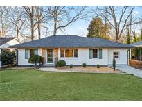 Newly renovated ranch home with a modern facade and landscaped lawn at 1573 Newton Se Ave, Atlanta, GA 30316