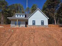 Newly constructed home with gray siding and stone accents at 458 Florence Rd, Douglasville, GA 30134