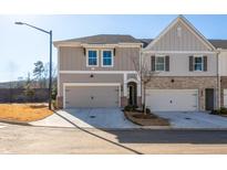 Modern two-story townhome with attached garage and landscaping at 701 Trevett Way, Marietta, GA 30062