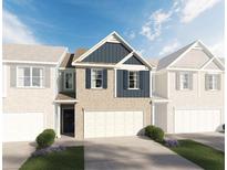 Two-story brick home with a modern design and attached garage at 653 Cygnet Ln, Grayson, GA 30017