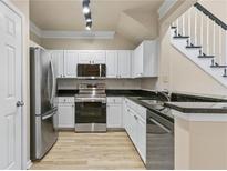 Modern kitchen features stainless steel appliances and granite countertops at 1850 Cotillion Dr # 2402, Atlanta, GA 30338