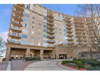 Elegant high rise building with balconies and landscaped grounds at 2950 Mount Wilkinson Se Pkwy # 304, Atlanta, GA 30339