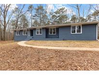 Newly renovated ranch home with gray brick exterior and landscaped yard at 4145 White Oak Dr, Winston, GA 30187