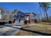Charming two-story home with a well-manicured front yard and attached two car garage at 3640 Autumn View Nw Dr, Acworth, GA 30101