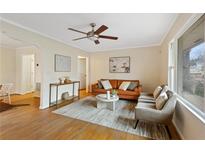 Bright living room with hardwood floors, comfy seating, and large windows at 491 Monument Se Ave, Atlanta, GA 30316