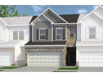 Two-story townhome with gray siding, brick accents, and a two-car garage at 205 Bastian Dr # 2, Villa Rica, GA 30180