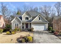 Two-story house with stone accents and a large driveway at 2669 Glenrose Hl, Atlanta, GA 30341