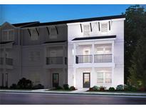 Two-story townhome with modern exterior and balcony at 4589 Red Lion Pl, Lawrenceville, GA 30044