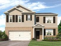 Two-story house with beige siding, brown accents, and a white three-car garage at 8238 Walnut Hall Dr, Fairburn, GA 30213