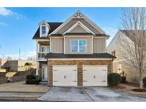 Two-story house with stone accents and a two-car garage at 5105 Deepwater Cv, Acworth, GA 30101
