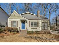 Charming craftsman home with a blue door and well-manicured lawn at 2590 Knox Ne St, Atlanta, GA 30317