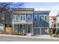 Two-story craftsman style home with front porch and two-car garage at 393 Summerhour St, Marietta, GA 30060