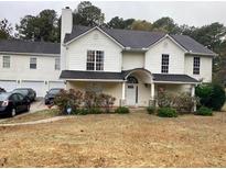 Two-story house with attached garage and landscaping at 923 Mary Frances Ct, Dacula, GA 30019