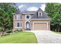 Beautiful two story home with a charming facade and manicured lawn at 2688 Moon Cabin Dr, Powder Springs, GA 30127