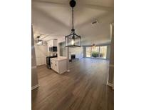 Open concept kitchen with stainless steel appliances and white shaker cabinets at 2002 Country Park Se Dr, Smyrna, GA 30080