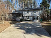 Two-story house with a porch and driveway at 4906 Holbrook Cir, Duluth, GA 30096