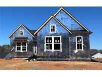 New construction home featuring a modern design with large window openings ready for your personal touch at 14 Cambridge Ln, Dallas, GA 30157
