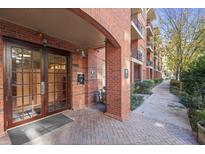 Brick building exterior with walkway and access to the building at 273 12Th Ne St # 421, Atlanta, GA 30309