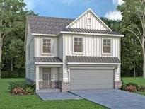 Two-story farmhouse style home with gray garage door and brick accents at 1822 Butterfly Way, Marietta, GA 30066