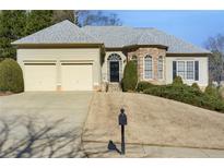 Two-story house with stone accents and a two-car garage at 200 Holly Chase Ct, Canton, GA 30114