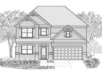 Two-story brick home with a two-car garage and landscaped front yard at 7179 Linden Dr, South Fulton, GA 30349