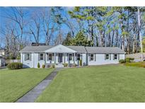 Newly renovated ranch home featuring a charming front yard and walkway at 40 Rhodes Dr, Marietta, GA 30068