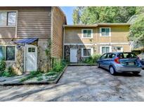 Exterior view of a townhome with parking at 574 Northridge Crossing Dr, Sandy Springs, GA 30350