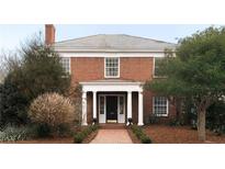 Brick home with a classic design, landscaped yard, and a welcoming front porch at 769 Penn Ne Ave, Atlanta, GA 30308