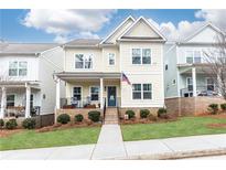 Two-story Craftsman style home with a welcoming front porch and landscaped yard at 830 Corsiglia, Marietta, GA 30060