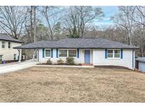 Charming ranch home with white brick exterior, landscaping, and a spacious yard at 2295 Cloverdale Se Dr, Atlanta, GA 30316