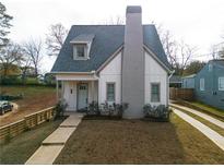 Charming craftsman style home with gray siding, a white door, and a spacious lawn at 330 Mount Zion Rd, Hapeville, GA 30354