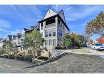 Luxury townhome with stone accents and a charming front porch at 6770 Cadence Blvd, Atlanta, GA 30328