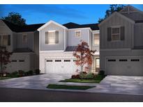 Two-story townhome with gray siding, white trim, and a two-car garage at 4175 Waratah Way, Mableton, GA 30126