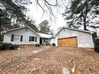 Ranch style home with attached garage needing repairs at 1783 Nicole Ln, Lithonia, GA 30058