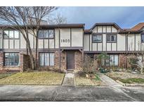 Brick townhouse exterior with landscaping and walkway at 1803 Ashborough Way # Apt F, Marietta, GA 30067