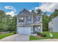 Two-story house with gray siding, stone accents, and a two-car garage at 204 Hickory Commons Way, Canton, GA 30115