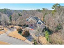 Elegant two-story home with large driveway and mature trees at 1401 Walcutts Nw Way, Marietta, GA 30064