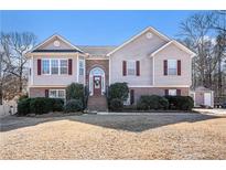 Charming two-story home featuring a brick foundation and red shutters at 230 Cobblestone Ln, Mcdonough, GA 30252