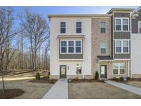 Modern 3-story townhome with white siding and gray accents at 200 Wallace St, Fayetteville, GA 30214