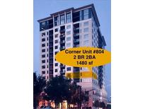 Contemporary condo building featuring a corner unit with large windows at 565 Peachtree Ne St # 804, Atlanta, GA 30308