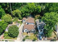 Aerial view of a charming home with lush landscaping and a spacious backyard at 790 Martina Ne Dr, Atlanta, GA 30305