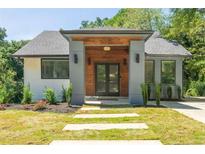 Modern house exterior with gray and wood accents at 726 Charlotte Pl, Atlanta, GA 30318
