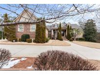 Brick house with a large front yard and driveway at 1731 Panorama Dr, Locust Grove, GA 30248
